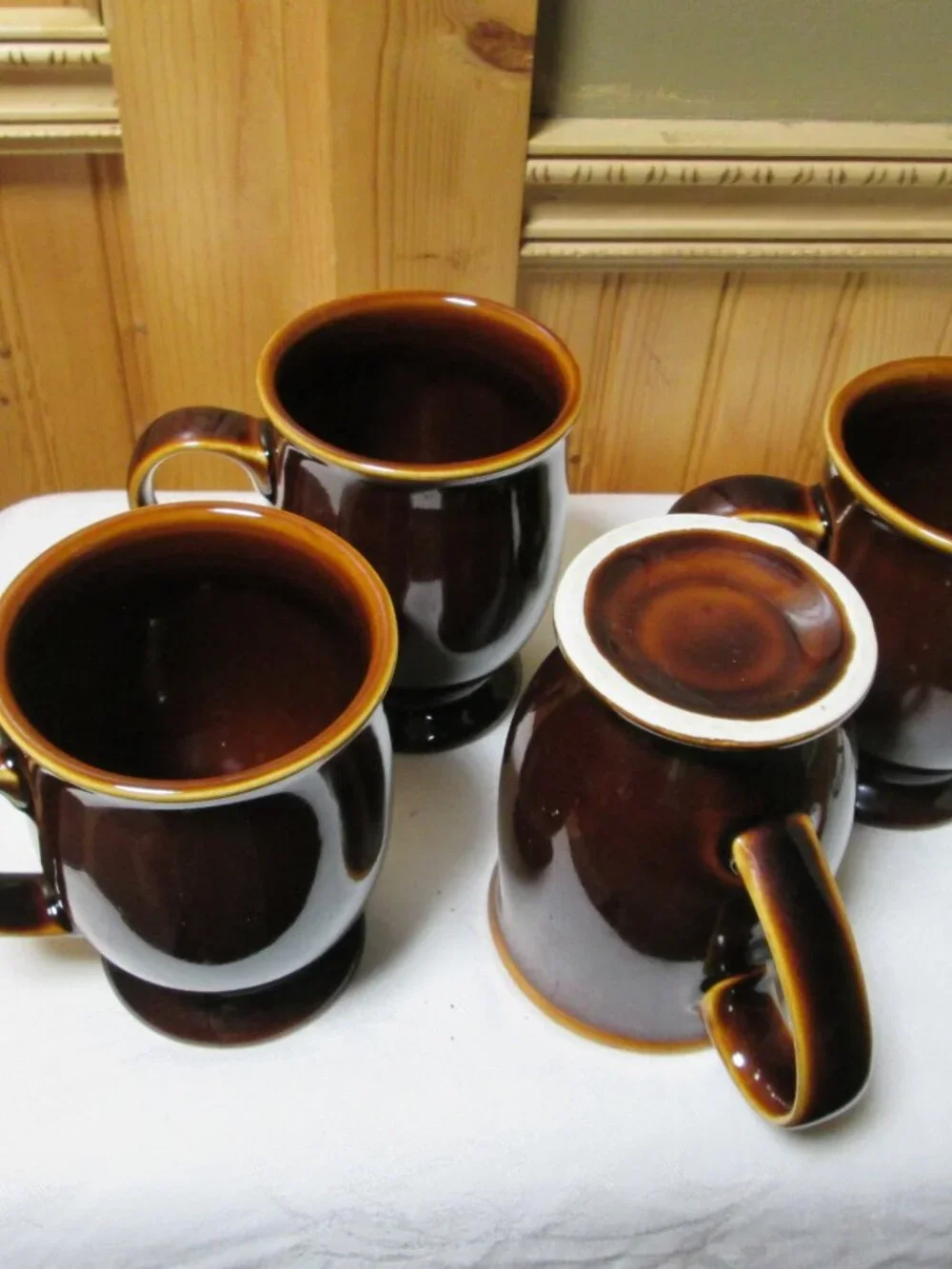 4 vtg Earthenware coffee mugs drip brown glaze pedestal